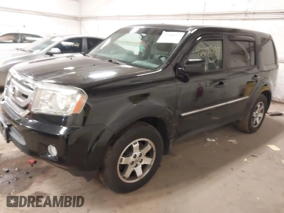 2009 Honda Pilot Touring with VIN 5FNYF48939B041166, listed as a IAAI auction lot 42098397 with 228,305 mi miles and . Bid and sale history available at carsss.com. Image 2.