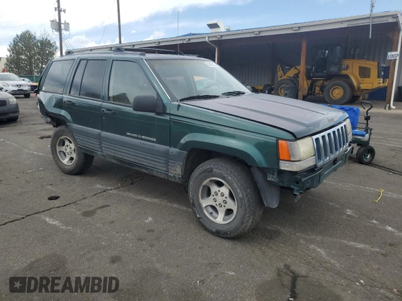 1996 Jeep Grand Cherokee Laredo with VIN 1J4GZ58S6TC165636, listed as a Copart auction lot 51485235 with 266,873 mi miles and Salvage Title. Bid and sale history available at carsss.com. Image 4.