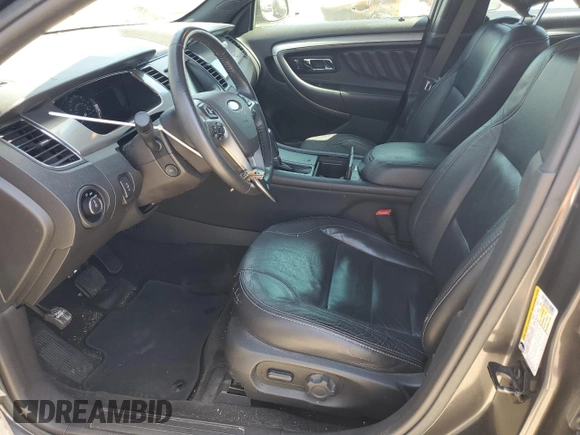 2015 Ford Taurus SEL with VIN 1FAHP2E8XFG209390, listed as a Copart auction lot 58992305 with 99,498 mi miles and Salvage title. Bid and sale history available at DreamBid. Image 7.