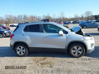 2016 Chevrolet Trax LT z VIN 3GNCJLSB7GL162268, wystawiony jako IAAI lot #41753118 z przebiegiem 123 599 mil mil oraz . Historia ofert i sprzedaży dostępna na DreamBid. Obrazek 13.