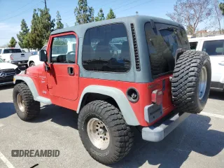 1999 Jeep Wrangler Sport with VIN 1J4FY19S7XP401120, listed as a Copart auction lot 64233665 with 129,708 mi miles and Salvage title. Bid and sale history available at DreamBid. Image 2.