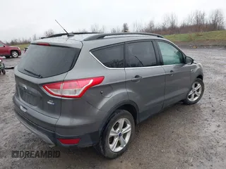 2014 Ford Escape SE with VIN 1FMCU9GX3EUB91417, listed as a IAAI auction lot 42009257 with 87,164 mi miles and . Bid and sale history available at DreamBid. Image 4.