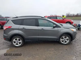 2014 Ford Escape SE with VIN 1FMCU9GX3EUB91417, listed as a IAAI auction lot 42009257 with 87,164 mi miles and . Bid and sale history available at DreamBid. Image 13.