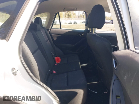 2016 Mazda CX-5 Sport with VIN JM3KE2BY9G0887110, listed as a IAAI auction lot 41761039 with 86,624 mi miles. Bid and sale history available at carsss.com. Image 8.