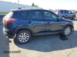 2015 Mazda CX-5 Sport with VIN JM3KE2BEXF0483141, listed as a Copart auction lot 59134105 with 71,727 mi miles and Salvage title. Bid and sale history available at DreamBid. Image 3.