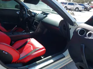 2004 Nissan 350Z Touring with VIN JN1AZ34E74T064156, listed as a IAAI auction lot 41498213 with 148,370 mi miles. Bid and sale history available at carsss.com. Image 5.
