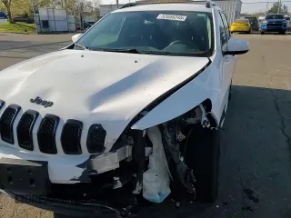 2016 Jeep Cherokee Altitude with VIN 1C4PJLCB1GW237968, listed as a Copart auction lot 52055245 with 99,075 mi miles and Salvage Title. Bid and sale history available at carsss.com. Image 12.