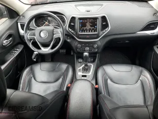 2014 Jeep Cherokee Trailhawk z VIN 1C4PJMBS2EW130125, wystawiony jako Copart lot #57830635 z przebiegiem 117 811 mil mil oraz Szkody całkowita. Historia ofert i sprzedaży dostępna na DreamBid. Obrazek 8.