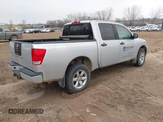 2012 Nissan Titan S with VIN 1N6AA0EJXCN310874, listed as a IAAI auction lot 42022787 with 162,317 mi miles. Bid and sale history available at carsss.com. Image 4.