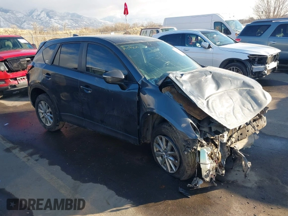 2016 Mazda CX-5 Touring with VIN JM3KE4CY0G0751040, listed as a IAAI auction lot 41290780 with 136,689 mi miles. Bid and sale history available at carsss.com. Image 1.