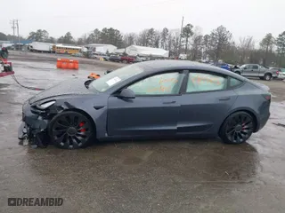 2022 Tesla Model 3 Performance with VIN 5YJ3E1EC2NF336135, listed as a IAAI auction lot 41853826 with 1 mi miles. Bid and sale history available at carsss.com. Image 14.