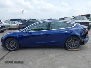 2019 Tesla Model 3 Mid Range with VIN 5YJ3E1EA5KF190453, listed as a IAAI auction lot 41880684 with 58,909 mi miles and . Bid and sale history available at carsss.com. Image 15.