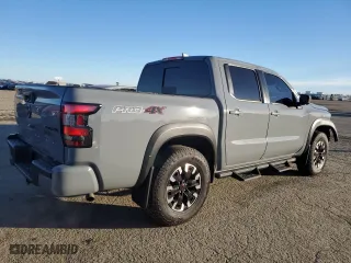 2023 Nissan Frontier PRO-4X with VIN 1N6ED1EK4PN669702, listed as a Copart auction lot 41687475 with 8,855 mi miles and Salvage Title. Bid and sale history available at carsss.com. Image 3.