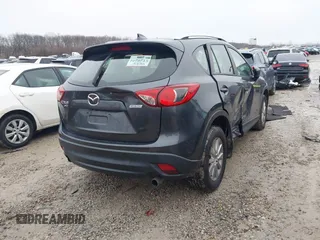 2016 Mazda CX-5 Sport with VIN JM3KE4BY5G0885754, listed as a IAAI auction lot 41103575 with 136,263 mi miles and . Bid and sale history available at carsss.com. Image 4.