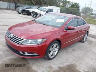 2014 Volkswagen CC Sport with VIN WVWBN7AN0EE527558, listed as a IAAI auction lot 41336204 with 130,005 mi miles and . Bid and sale history available at DreamBid. Image 2.