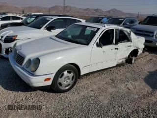 1999 Mercedes-Benz E-Class with VIN WDBJF70H5XA831773, listed as a Copart auction lot 71320244 with 145,181 mi miles and Salvage Title. Bid and sale history available at carsss.com. Image 1.