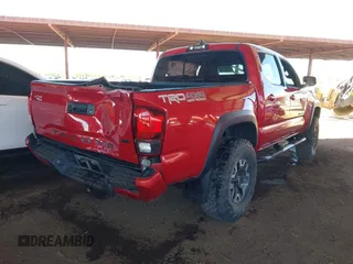 2018 Toyota Tacoma SR with VIN 3TMCZ5AN8JM141486, listed as a IAAI auction lot 42142145 with 54,851 mi miles and . Bid and sale history available at DreamBid. Image 4.