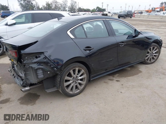 2021 Mazda 3 Premium with VIN JM1BPADL4M1329041, listed as a IAAI auction lot 42291604 with 93,248 mi miles and . Bid and sale history available at DreamBid. Image 4.