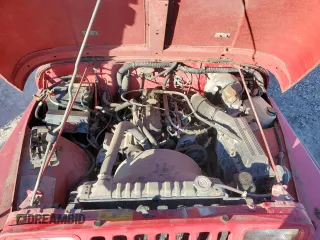 1991 Jeep Wrangler z VIN 2J4FY19P6MJ107521, wystawiony jako Copart lot #84077214 z przebiegiem 1 311 216 mil mil oraz Czysty tytuł • Clean title. Historia ofert i sprzedaży dostępna na DreamBid. Obrazek 11.