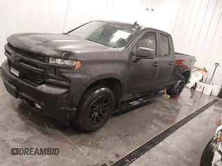 2021 Chevrolet Silverado 1500 RST with VIN 1GCRYEEDXMZ135111, listed as a IAAI auction lot 41398152 with 54,051 mi miles and . Bid and sale history available at DreamBid. Image 2.