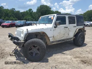 2015 Jeep Wrangler Unlimited Rubicon with VIN 1C4BJWFG6FL710993, listed as a Copart auction lot 62308195 with 103,938 mi miles and Salvage title. Bid and sale history available at DreamBid. Image 1.