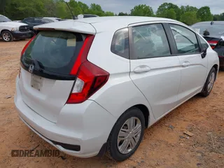 2019 Honda Fit LX z VIN 3HGGK5H4XKM704303, wystawiony jako IAAI lot #42019753 z przebiegiem 137 271 mil mil oraz . Historia ofert i sprzedaży dostępna na DreamBid. Obrazek 4.