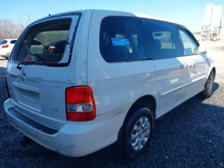 2004 Kia Sedona LX with VIN KNDUP131046577380, listed as a IAAI auction lot 41468710 with 138,451 mi miles and . Bid and sale history available at DreamBid. Image 4.
