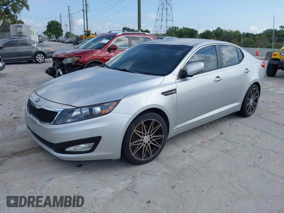 2013 Kia Optima LX with VIN KNAGM4A75D5380478, listed as a IAAI auction lot 42153829 with 82,845 mi miles. Bid and sale history available at carsss.com. Image 2.
