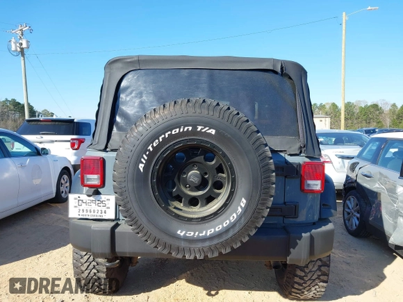 2015 Jeep Wrangler Sport with VIN 1C4AJWAG0FL591213, listed as a IAAI auction lot 41893306 with 107,807 mi miles and . Bid and sale history available at DreamBid. Image 16.