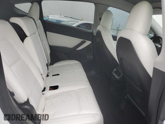 2020 Tesla Model Y Long Range z VIN 5YJYGDEE4LF052702, wystawiony jako Copart lot #53243385 z przebiegiem 75 917 mil mil oraz Szkoda całkowita • Salvage title. Historia ofert i sprzedaży dostępna na DreamBid. Obrazek 11.