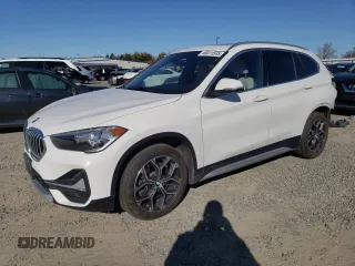 2020 BMW X1 sDrive28i with VIN WBXJG7C09L5P28561, listed as a Copart auction lot 48411545 with 65,062 mi miles and Salvage Title. Bid and sale history available at carsss.com. Image 1.