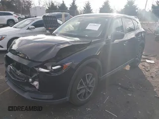 2018 Mazda CX-5 Touring z VIN JM3KFACM3J1435089, wystawiony jako IAAI lot #41130041 z przebiegiem 80 446 mil mil oraz . Historia ofert i sprzedaży dostępna na DreamBid. Obrazek 17.