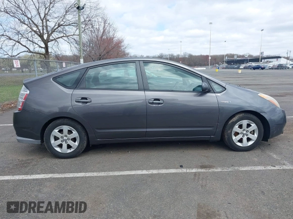 2007 Toyota Prius z VIN JTDKB20U073266399, wystawiony jako IAAI lot #41947176 z przebiegiem 186 258 mil mil oraz . Historia ofert i sprzedaży dostępna na DreamBid. Obrazek 13.