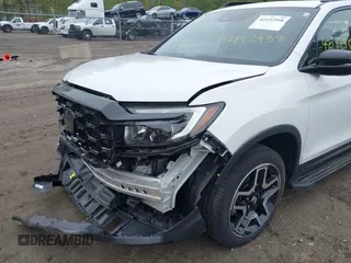 2023 Honda Passport Elite with VIN 5FNYF8H00PB022743, listed as a IAAI auction lot 42192958 with 25,165 mi miles and . Bid and sale history available at DreamBid. Image 6.