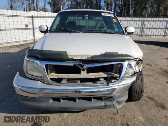 2000 Ford F-150 XL with VIN 1FTRX17L1YNA26050, listed as a Copart auction lot 43597105 with 205,152 mi miles and Salvage Title. Bid and sale history available at carsss.com. Image 5.