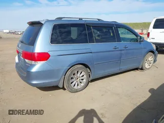 2008 Honda Odyssey Touring with VIN 5FNRL38868B047556, listed as a IAAI auction lot 41581617 with 220,436 mi miles. Bid and sale history available at carsss.com. Image 4.
