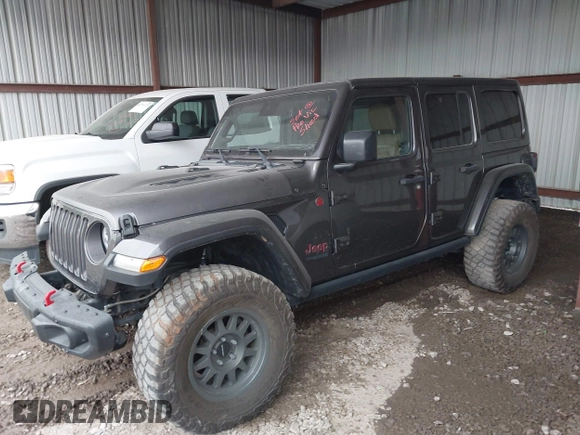 2021 Jeep Wrangler Unlimited Rubicon with VIN 1C4JJXFM6MW538774, listed as a IAAI auction lot 42368651 with 49,490 mi miles and . Bid and sale history available at DreamBid. Image 14.