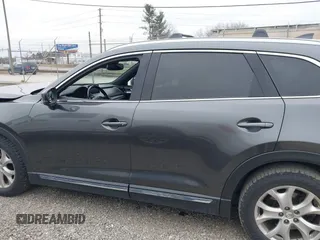 2016 Mazda CX-9 Grand Touring with VIN JM3TCBDY1G0103560, listed as a IAAI auction lot 41344813 with 123,588 mi miles and . Bid and sale history available at DreamBid. Image 14.