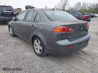 2008 Mitsubishi Lancer DE with VIN JA3AU26U48U012900, listed as a IAAI auction lot 41988059 with 216,797 mi miles. Bid and sale history available at carsss.com. Image 3.