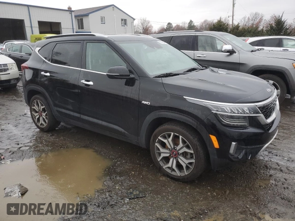 2021 Kia Seltos SX with VIN KNDETCA29M7217543, listed as a Copart auction lot 82009644 with 56,270 mi miles and Salvage Title. Bid and sale history available at carsss.com. Image 4.