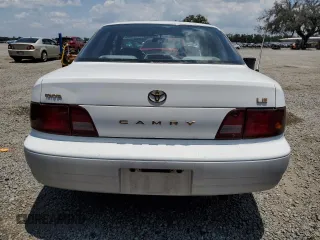 1995 Toyota Camry LE with VIN 4T1SK12E4SU878765, listed as a Copart auction lot 57761385 with 181,674 mi miles and Clean title. Bid and sale history available at DreamBid. Image 6.