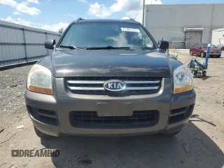 2005 Kia Sportage LX z VIN KNDJE723657121717, wystawiony jako Copart lot #61407575 z przebiegiem Nie podano mil oraz Czysty tytuł • Clean title. Historia ofert i sprzedaży dostępna na DreamBid. Obrazek 5.