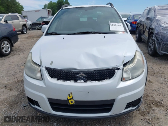 2012 Suzuki SX4 Crossover z VIN JS2YB5A35C6304967, wystawiony jako IAAI lot #42282088 z przebiegiem 152 232 mil mil oraz . Historia ofert i sprzedaży dostępna na DreamBid. Obrazek 12.
