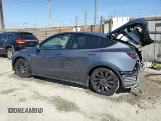 2023 Tesla Model Y Performance with VIN 7SAYGDEF0PF915030, listed as a Copart auction lot 50159375 with 19,772 mi miles and Salvage Title. Bid and sale history available at DreamBid. Image 2.