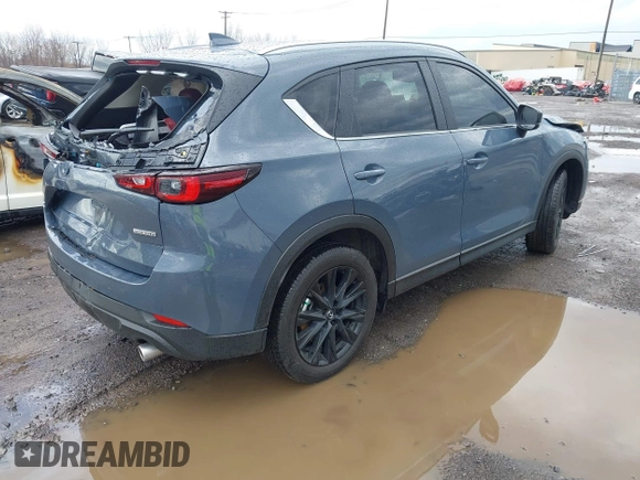 2024 Mazda CX-5 S Carbon Edition z VIN JM3KFBCL1R0470051, wystawiony jako IAAI lot #42088186 z przebiegiem 10 285 mil mil oraz . Historia ofert i sprzedaży dostępna na DreamBid. Obrazek 4.