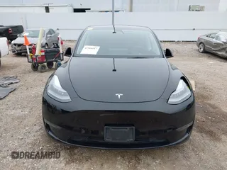 2023 Tesla Model Y Long Range z VIN 7SAYGDEEXPA181114, wystawiony jako IAAI lot #41564617 z przebiegiem 64 990 mil mil oraz . Historia ofert i sprzedaży dostępna na DreamBid. Obrazek 13.