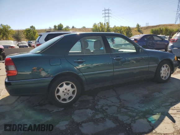 1997 Mercedes-Benz C with VIN WDBHA23EXVF507185, listed as a Copart auction lot 73716364 with 167,171 mi miles and Salvage title. Bid and sale history available at DreamBid. Image 3.