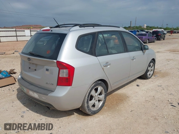 2007 Kia Rondo LX with VIN KNAFG526077069189, listed as a IAAI auction lot 42090474 with 96,722 mi miles. Bid and sale history available at carsss.com. Image 4.