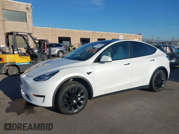 2021 Tesla Model Y Standard Range z VIN 5YJYGDED4MF123311, wystawiony jako IAAI lot #41200519 z przebiegiem 70 190 mil mil oraz . Historia ofert i sprzedaży dostępna na DreamBid. Obrazek 19.