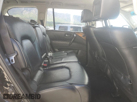 2012 Infiniti QX56 8-passenger z VIN JN8AZ2NCXC9317541, wystawiony jako Copart lot #57719945 z przebiegiem 200 069 mil mil oraz Czysty tytuł • Clean title. Historia ofert i sprzedaży dostępna na DreamBid. Obrazek 11.